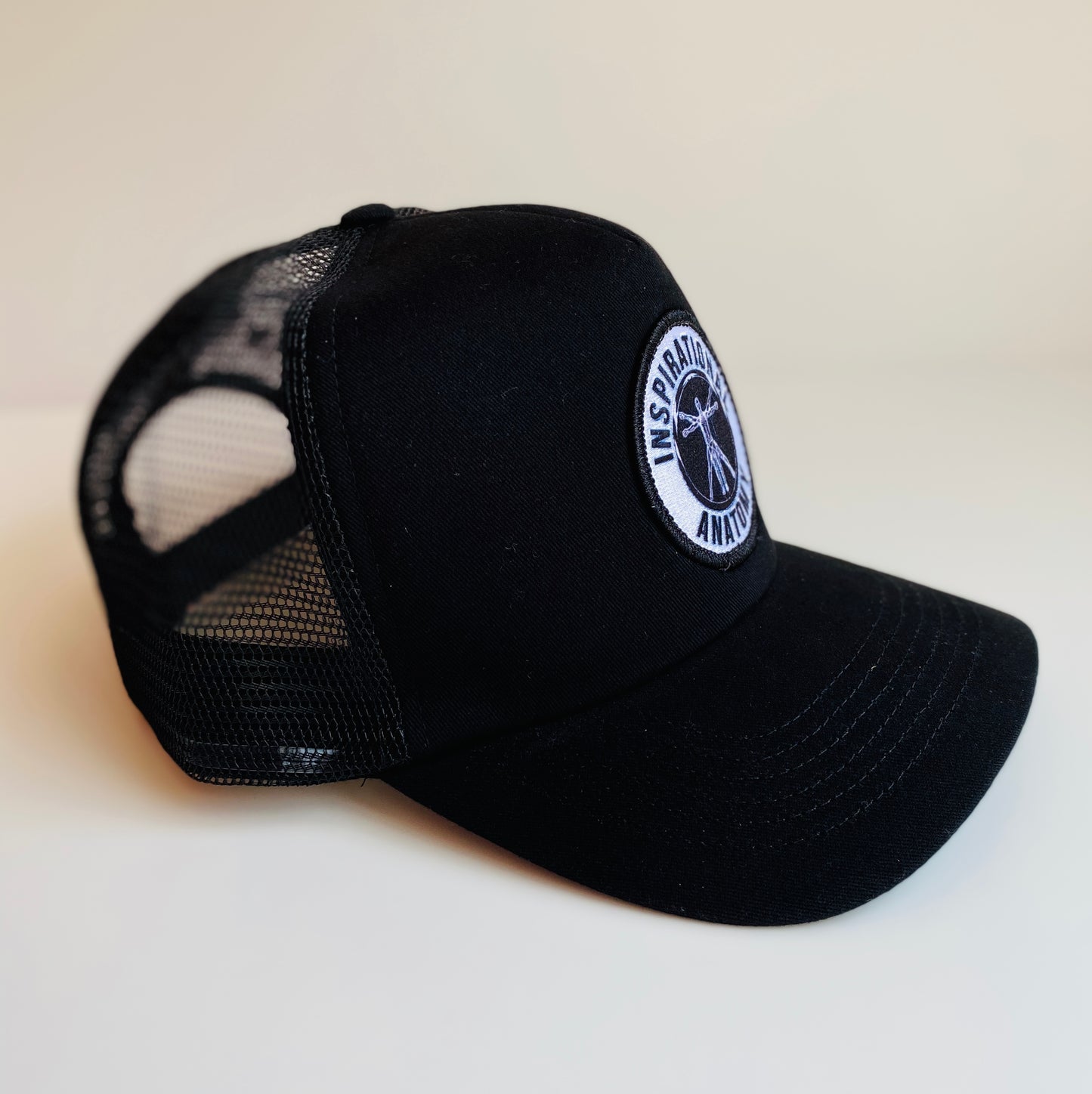 Black intelligence trucker hat